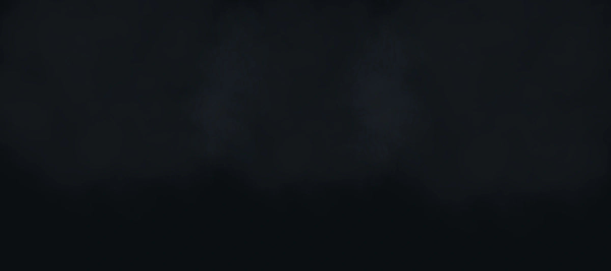 A very dark, nearly black background with faint smoky gray highlights and no visible product, person, text, or branding.